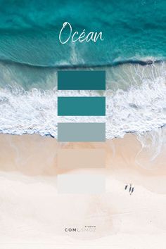 an aerial view of the ocean with two people walking in the sand and one person laying on the beach