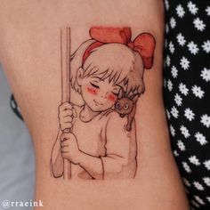 a girl with a red bow on her head holding a baseball bat