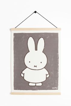 a wooden sign with a rabbit on it's face and the word miffy written in