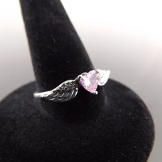 New .925 Sterling Silver Pink Sapphire Crystal Winged Heart Ring Size 7 Never Worn The Perfect Gift For A Beautiful Cowgirl Or Darling Angel Of Your Life. Embrace Timeless Elegance With This Exquisite New .925 Sterling Silver Pink Sapphire Crystal Winged Heart Ring In Size 7. Crafted With Precision And Adorned With A Dazzling Pink Sapphire Crystal, This Enchanting Piece Is A Perfect Blend Of Sophistication And Romance. Whether It's A Gift For A Loved One Or A Well-Deserved Treat For Yourself, Th Angel Wing Ring, Angel Ring, Winged Heart, Funky Jewelry, Ring Size 7, Sapphire Crystal, Pink Sapphire, Womens Jewelry Rings, Heart Ring