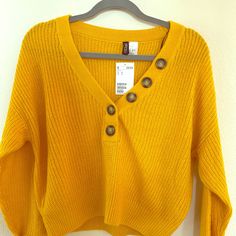 H&M Cute Sweater - Lightweight, Cute Button Detail! Comes In A Shorter Length So Very Flattering With Jeans And Shorts For Spring! Brand New With Tags. Yellow Long Sleeve Sweater With Button Closure, Yellow V-neck Top With Button Closure, Yellow Sweater With Button Closure For Spring, Yellow Sweater With Button Closure For Winter, Yellow Buttoned Sweater For Fall, Fall Yellow Sweater With Buttons, H&m Winter Tops, Yellow Button Sweater For Spring, Yellow Buttoned Sweater For Spring