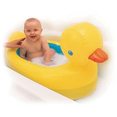 a baby in an inflatable ducky bath tub