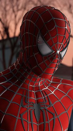 a close up of a spider - man face with trees in the background