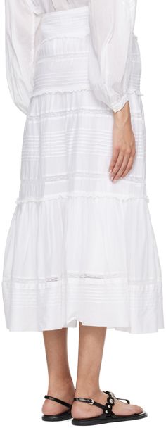 Organic cotton voile and lace skirt. Ruffled trim and pleats throughout. · Button closure · Central vent at front hem · Full cotton poplin lining Supplier color: White Daywear Ruffled Tiered Skirt Petticoat, Daywear Tiered Petticoat With Ruffles, Daywear Tiered Skirt Petticoat With Ruffles, Daywear Ruffled Petticoat, Daywear Dresses With Long Ruffled Skirt, Daywear Dresses With Full Ruffled Skirt, Cotton Skirt With Lace Trim For Daywear, Full Skirt Day Dresses With Ruffled Detail, Cotton Skirt With Ruffle Hem For Daywear