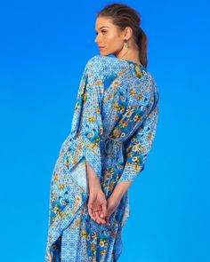 Our cinched long kaftan bears all the comfort of a kaftan while accentuating the waist. The print features a burst of florals weaving through a fine porcelain motif. A sophisticated kaftan that spells of adventure on the Mediterranean Sea. • 100% easy care, breathable washable viscose • Slips on• Ruched in the front and ties in the back • Length: 53.5"• Placement print throughout • Gentle wash cycle, tumble dry low or dry clean • Made in India SHOP ALL KAFTANS Patterned Dress With Floral Print And Kimono Sleeves, Patterned Dresses With Floral Print And Kimono Sleeves, Blue Bohemian Tunic For Daywear, Daywear Dresses With Floral Print And Kimono Sleeves, Bohemian Floral Print Patterned Kaftan, Bohemian Patterned Kaftan With Floral Print, Bohemian Kaftan With Floral Print And Kimono Sleeves, Patterned Floral Print Long Sleeve Kaftan, Flowy Floral Print Kaftan For Daywear