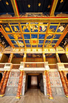 the inside of a building with painted ceilings