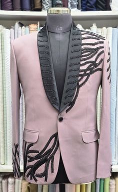 ## Make a statement with this exquisite embellished blazer! This unique blazer is sure to turn heads with its stunning design and intricate details. Crafted from premium quality fabric, this blazer features an elegant dusty pink hue, perfectly balanced by the dramatic black embellishments that adorn the collar and lapels. The delicate beadwork creates a captivating pattern reminiscent of intricate vines, adding a touch of artistry to the overall aesthetic. This blazer is a perfect choice for a s Pink Tuxedo Wedding, Black Groomsmen Suits, Unique Blazer, Tuxedo Wedding Suit, Pink Tuxedo, Embellished Blazer, Hand Embroidery Work, Stylish Blazer, 2 Piece Suit