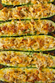 zucchini stuffed with chicken and cheese on a baking sheet, ready to be eaten