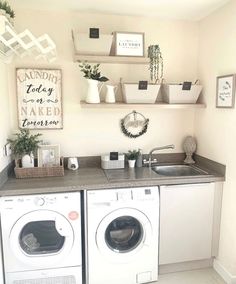 a washer and dryer sitting in a kitchen next to each other on top of a counter