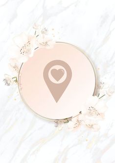 an image of a map pin with flowers around it on a white marble background that is in the shape of a circle