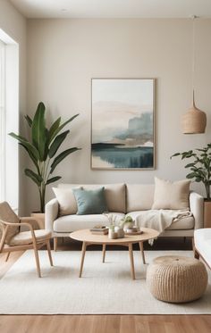 a living room filled with furniture and a painting on the wall above it's coffee table