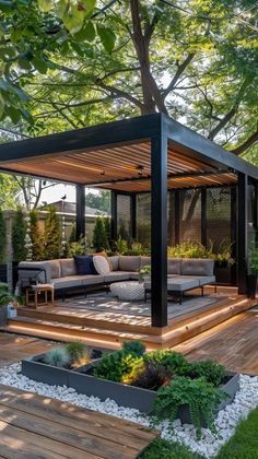 an outdoor living area with wooden decking and plants