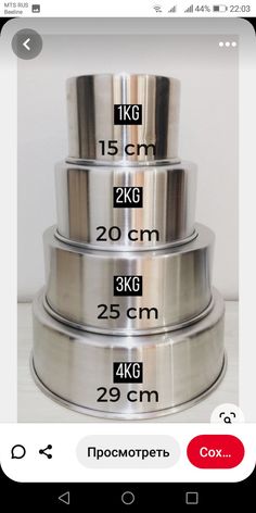 three stainless steel bowls stacked on top of each other with measurements in front of them