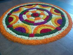 a circular flower arrangement on the floor