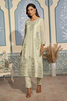 Creamy off-white tissue Banarasi kurta with floral woven motifs and silver zari work highlights. Comes with Banarasi dupatta and pant. - Aza Fashions Elegant Pista Green Salwar Kameez With Chikankari, Elegant Transitional Tussar Silk Sets, Elegant Pista Green Traditional Wear For Transitional Season, Elegant Transitional Pista Green Traditional Wear, Semi-stitched Off White Traditional Wear With Self Design, Elegant Pista Green Kurta For Transitional Season, Off White Traditional Wear With Self Design For Eid, Eid Traditional Wear In Off White With Self Design, Elegant Off White Embroidered Fabric For Festive Season