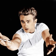 a young man holding a tennis racquet on top of a black background,