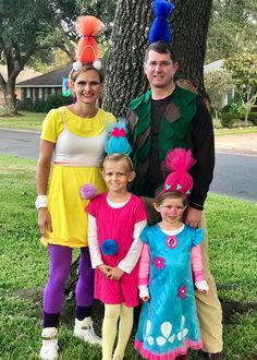 the family is dressed up in costumes for halloween