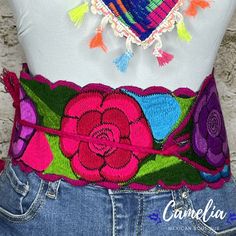 Color it up with one of our beautiful Mexican Belts for a chic western look. Made of 100% cotton with adjustable tie straps. Can be tied to the side, back or front. All belts are hand made and each design is unique. Available in two floral designs and solids. See our collection of belts here. Color is based on trim. Match it with one of our other Mexican Accessories: Espadrilles, Necklace, Shawl or Mexican Clutch. Perfect for any Mexican Themed party celebration. MEASUREMENTS: 4" Wide x 33" Long Adjustable Belts For Spring Festival, Spring Festival Fabric Belt, Embroidered Belt For Summer Beach, Summer Beach Embroidered Belt, Mexican Belts, Mexican Belt, Mexican Accessories, Mexican Themed Party, Mexican Hat