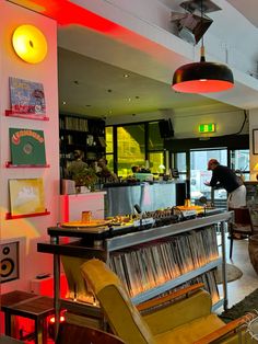 a bar with lots of records on the wall