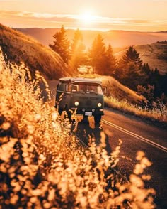 a van driving down a country road with the sun setting in the background and an inspirational quote