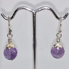 "SHIMMERING Natural Amethyst & Sterling Silver Earrings!! This is for one pair of natural royal purple Amethyst earrings. These amethyst earrings are absolutely the most incredible bright purple! Great earrings for a night out or a little shimmer for the office! These are natural amethyst earrings with Sterling Silver ear-wires and findings. NOTE: Images do not reflect number and size. Please see detail and table for information. NOTE: You will receive the earrings imaged. Quantity: 1 pair o Nickel-free Amethyst Lavender Earrings, Nickel-free Lavender Amethyst Earrings, Lavender Amethyst Round Earrings, Purple Amethyst Hypoallergenic Earrings, Purple Hypoallergenic Amethyst Earrings, Hypoallergenic Purple Amethyst Earrings, Faceted Amethyst Round Earrings, Purple Amethyst Earrings, Wolf Pendant Necklace