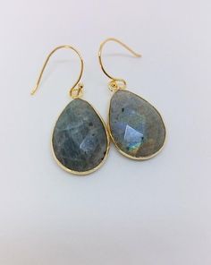 Lore of the Inuit peoples claim Labradorite fell from the frozen fire of the Aurora Borealis.Labradorite is such an amazing stone with its different gray tones and its mystical lightshine depending on the angle you are seeing it. Gold-filled with 24K Gold.Available in the sizes 30mm x 20mm20mm x 15mm Single Pearl Earrings, Raw Amethyst Ring, The Aurora Borealis, Gray Tones, Labradorite Earrings, Raw Amethyst, The Aurora, Grey Tones, Amethyst Ring