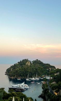 an island with many boats in the water