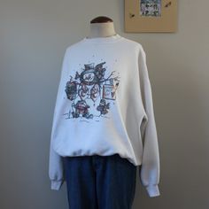 "Vintage snowman sweatshirt from the late 90s-early 2000s. Labeled size XL. Please see measurements for accurate fit. Measurements (taken laid flat, doubled where necessary): Length: 25\" Shoulders: 24\" Chest: 46\" Sleeve length: 20.5\" Condition: Good vintage condition. Light discoloration (pictured). No other notable signs of wear. Mannequin is a size Medium and measures 34,27,34. Height 5'6\" Thank you for visiting Bug B. v i s i t t h e s h o p www.BugBVintage.etsy.com i n s t a g r a m @Bu 90s Style Relaxed Fit Winter Sweatshirt, Relaxed Fit 90s Sweatshirt For Winter, Relaxed 90s Style Winter Sweatshirt, Oversized 90s Sweater With Graphic Print, Oversized 90s Graphic Print Sweater, 90s Style Relaxed Fit Winter Tops, Snowman Sweatshirt, Vintage Snowman, Vintage Crewneck