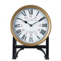 a clock with roman numerals is shown against a white background