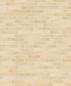 a beige brick wall with white bricks on it