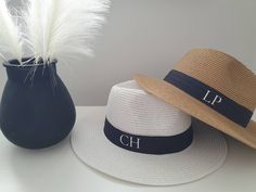 These hats are amazing as a bridal party gift, honeymoon or just for your holiday! Personalised with your initials on the side of the ribbon. These are also amazing his and hers gifts. Stylish Straw Fedora hats.  They can be made smaller using the internal ribbon. Outside black ribbon on hat is pleated! Available in white, cream or brown All one size 56-58cm with an internal adjuster draw string inside to adjust your own head size. PLEASE MEASURE THE CIRCUMFERENCE OF YOUR HEAD IF UNSURE ON SIZING! This is standard sizing. Personalised with initials Perfect for holidays, honeymoons, hen party's etc. Message for bulk price quotes for 5 or more items. Please measure you're head if you are unsure the hat will fit! Adjustable Short Brim Sun Hat As Gift, Adjustable Sun Hat With Short Brim, Summer Wedding Hats With Curved Brim, Adjustable Wide Brim Hat For Gift, Personalized White Wedding Hat, Personalized Curved Brim Hats For The Beach, Personalized Curved Brim Hat For Beach, Personalized Adjustable Hats For Wedding, Personalized Curved Brim Beach Hat