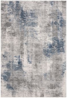 an abstract rug with blue and grey colors on it, including the area rug in the middle