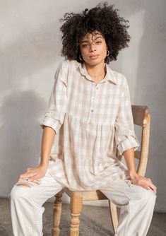 Just in time for Spring, our best-selling lightweight tunic top is back in a classic retro gingham check. Featuring a rolled long sleeve with button tab closure, a roomy tiered body for extra movement and flow, and a button-up front. A versatile cotton-blend top that pairs effortlessly with denim. FINAL SALE Large gingham check Relaxed fit Rolled sleeve with button tab closure Long tunic length Tiered body Collared neckline Button front Popover style Resort top Model is 5'8, wearing a size S in Oversized Plaid Blouse For Spring, Gingham Long Sleeve Blouse For Day Out, Long Sleeve Gingham Blouse For Day Out, Casual Gingham Blouse For Daywear, Casual Gingham Blouse For Fall, Spring Gingham Button-up Blouse, Spring Button-up Gingham Blouse, Long Tunic, Gingham Check