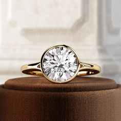 a close up of a ring with a diamond on it