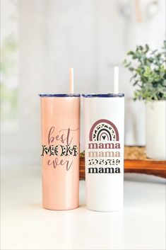 two personalized tumblers sitting next to each other on top of a white counter