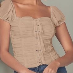 This Pretty And Prim Square Neck Top Features Dainty Puff Sleeves Against A Cropped, Ruched Lace Up Bodice. This Versatile Standout Piece Can Pair With Everything From Polished Trousers, To Flowy Boho Shorts To A Sexy High Waisted Mini Skirt! 100% Polyester.Size Medium New With Tags! Please Check Pictures And Message For Any Additional Info! Fitted Smocked Top With Ruched Details, Casual Ruched Square Neck Top, Trendy Ruched Smocked Top With Short Sleeves, Trendy Fitted Smocked Top With Ruched Details, Trendy Fitted Ruched Smocked Top, Trendy Ruched Solid Color Blouse, Casual Ruched Square Neck Blouse, Casual Square Neck Ruched Blouse, Trendy Solid Ruched Blouse