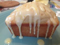 a close up of a cake on a plate with icing drizzled