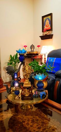 a living room filled with lots of furniture and plants on top of a coffee table