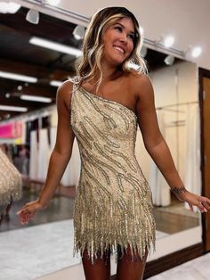 A dazzling choice for your special occasion. This sheath-style dress features a sparkling sequin fabric, a chic one-shoulder neckline, and sleeveless design. Adorned with shimmering sequins, delicate appliques, and playful fringes, it exudes glamour and sophistication. Complete with a zipper back for a perfect fit, it's available in Gold and Blue colors, ensuring you shine brightly at any event. Details: Silhouette: Sheath Style Fabric: Sequin Fabric Color: Gold, Blue Color Length: Short Length Senior Hoco, Fall Ball, Sparkly Shorts, Beaded Party Dress, Lovely Partner, White Homecoming Dresses, Hoco Dress, One Shoulder Cocktail Dress, Blue Homecoming Dresses