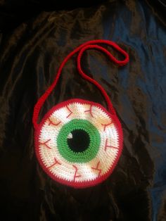 Stand out from the crowd and embrace your unique personality with this eye-popping crochet bag.  The strap is 30 inches but does stretch the more you use it. Spooky Season Crochet, Bloodshot Eye, Crochet Spooky, Retro Crochet, Fall Crochet Patterns, Crochet Fairy, Bag Pattern Free