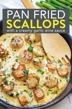 pan fried scallops with creamy garlic wine sauce in a cast iron skillet