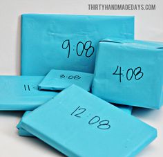 four blue blocks with numbers written on them