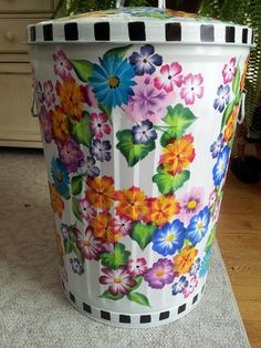 a large flower pot sitting on top of a wooden floor