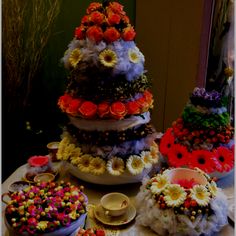 a table topped with lots of different types of cakes