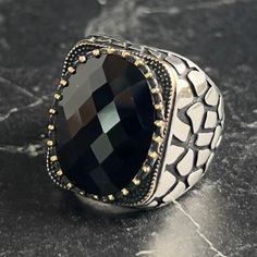 Men's Oval Onyx Black Gemstone Silver Ring , Men Black Stone Ring , Handcrafted Piece Pattern Ring , Turkish Handmade Jewelry , Gift for Him , Same Day For Shipping ✧ Product Details * Handmade İtem * Gender : Male / Female * Material : 925K Sterling Silver * Ring Weight : 17 Grams * Gemstone Type : Black Onyx ✔ Usage Details * Silver jewelry is very sensitive to chemicals. It is recommended to keep away from chemical substances such as cream, bleach, deodorant, detergent. * Silver jewelry can also darken quickly in salt water, that is, in sea water. For this reason, it is best to remove them when swimming in the sea. ✔ Shipping * Your orders placed on weekdays are delivered to the cargo on the same day. Your orders placed on the weekend are delivered to the cargo on Monday. ✔ Other Detail Formal Black Jewelry With Large Stone, Luxury Handmade Black Rings, Luxury Adjustable Black Rings, Luxury Black Oval Men's Ring, Black Rings With Large Stone For Gift, Black Ring With Large Stone For Gift, Handmade Black Oval Crystal Ring, Luxury Men's Onyx Ring For Gift, Luxury Silver Onyx Signet Ring