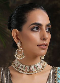 Borrowing from the age old technique of Pakistani aari and Punjabi jadau work, this necklace set is based in silver alloy and plated with 22k gold. The combination of these pristine colours paints a lovely picture embellished with shell pearls and semi precious stones. Necklace Closure - Adjustable Dori Earrings Closure - Push Back Style Tip - Versatility and elegance being the strong suit, we leave a lot to your imagination for how you want to dress your jewels your way and embracing your perso Jadau Long Necklace, Brass Meenakari Necklace For Wedding, Gold Kundan Multi-stone Temple Necklace, Jadau Necklace Set, Jadau Three Piece Necklace, Jadau Necklace, Necklace Closure, Gold Bollywood Multi-stone Necklace, Rakhi Design