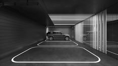 a black and white photo of a car in a parking garage with the door open