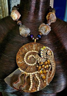 This gorgeous one-of-a-kind piece is from my private collection, and is unworn.  A gorgeous druzy pocket ammonite fossil is bejeweled with an ornate art deco style topaz rhinestone jewel and citrine aurora borealis rhinestones.  The pendant is suspended from an adjustable 16-19" statement necklace comprised of rough ag Rocker Chic Accessories, Bold Women, Jewellery Shop Design, Unique Pendant Necklace, Crystal Statement Necklace, Ammonite Fossil, Mermaid Necklace, Beaded Bracelet Patterns, Western Jewelry