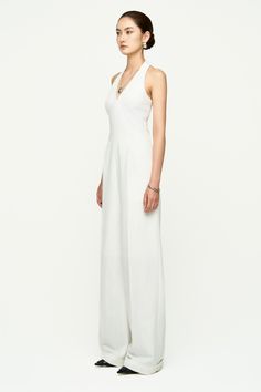 This jumpsuit is crafted from high-quality twill fabric, ensuring durability and comfort. The halter neckline and side pockets provide practicality, while the floor-length design adds elegance. Perfect for both casual and formal occasions, this jumpsuit offers versatility and effortless style. Length:- Top body: 40cm/41cm/42cm (S/M/L)- Low body: 104cm/105cm/106cm (S/M/L) Elegant Halter Neck Jumpsuit For Work, Elegant Halter Neck Jumpsuits And Rompers For Formal Occasions, Elegant Formal Halter Neck Jumpsuits And Rompers, Elegant Formal Halter Neck Jumpsuits, Halter Neckline, Special Features, Formal Occasion, Floor Length, Effortless Style