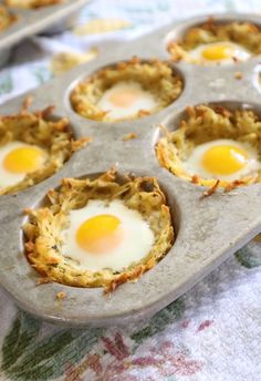 an egg in a muffin tin on a table